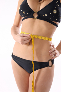 Image of a Woman Measuring her Waist